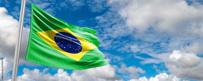 The flag of Brazil flutters in the wind in the center of the flag with the words order and progress Brazil election: ex-president Luiz Inácio Lula da Silva to face Jair Bolsonaro in runoff